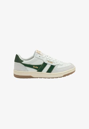 White and green Gola sneaker with beige sole, lace-up front, and logo on side and tongue, shown in profile facing right.