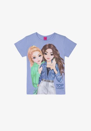 Maglietta lilla con due ragazze illustrate, una bionda con felpa verde e una bruna con giacca di jeans, etichettate "Christy" e "Talita", testo "TOP Model."