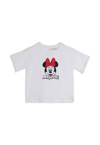 Camiseta blanca de manga corta hecha de algodón, con una gráfica de la cara de un personaje con un lazo rojo y la palabra "MINNIE" debajo.