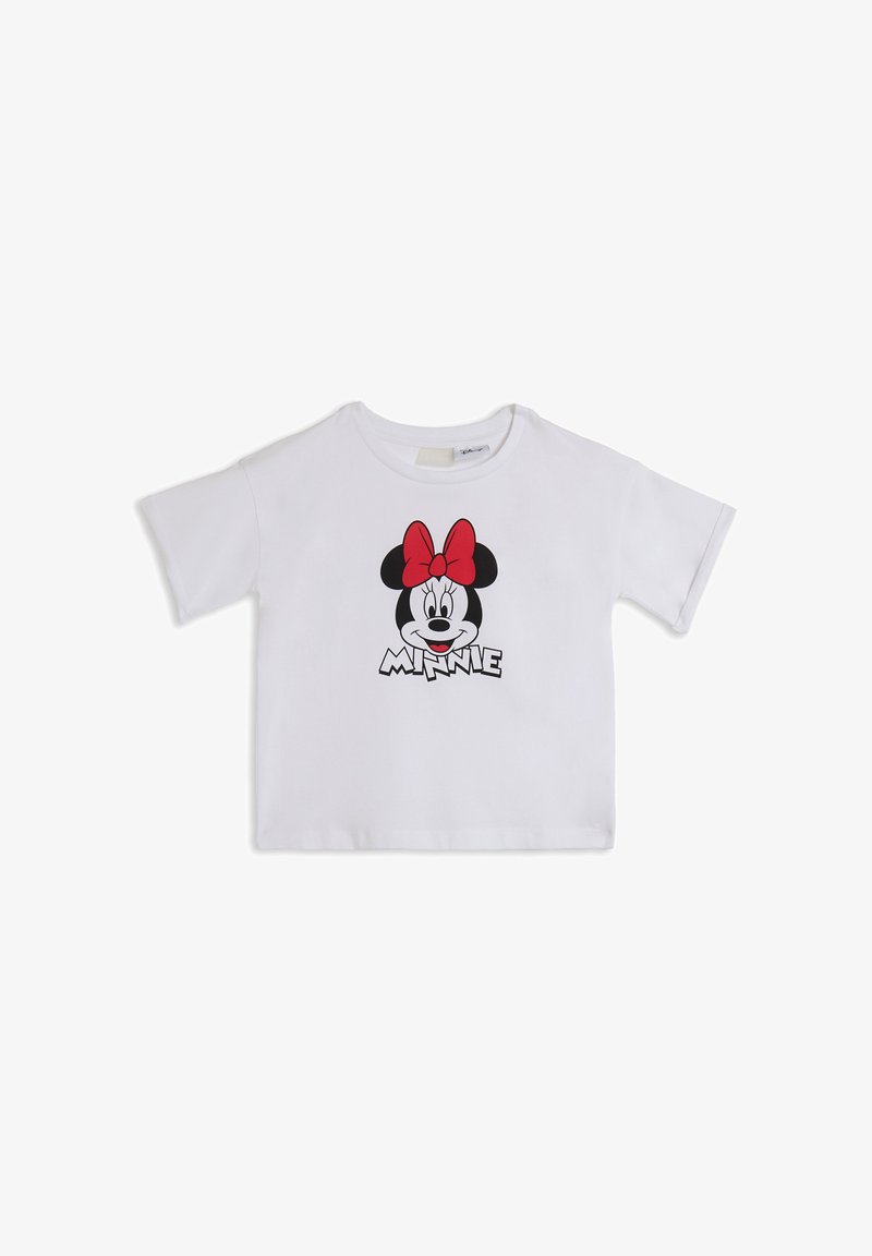 Camiseta blanca de manga corta hecha de algodón, con una gráfica de la cara de un personaje con un lazo rojo y la palabra "MINNIE" debajo.