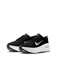 Scarpe sportive nere con tomaia in rete testurizzata, soletta di ammortizzazione bianca e suola nera prominente. Presentano il logo Nike argentato e il marchio ZoomX.