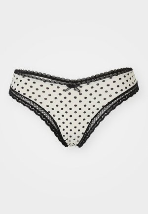 Zwart-witte onderbroek met stippen en kantafwerking, met een klein strikje aan de voorkant en contrasterende zwarte randen.