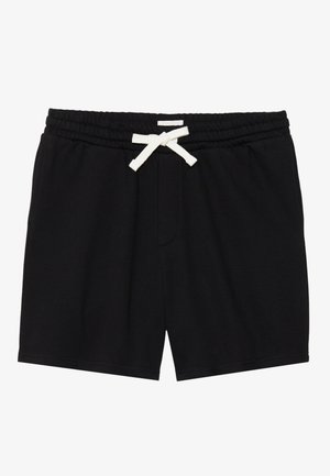 Shorts de jogging en coton noir avec une taille élastique et un cordon blanc, dotés de poches latérales et d'un design simple et minimaliste.