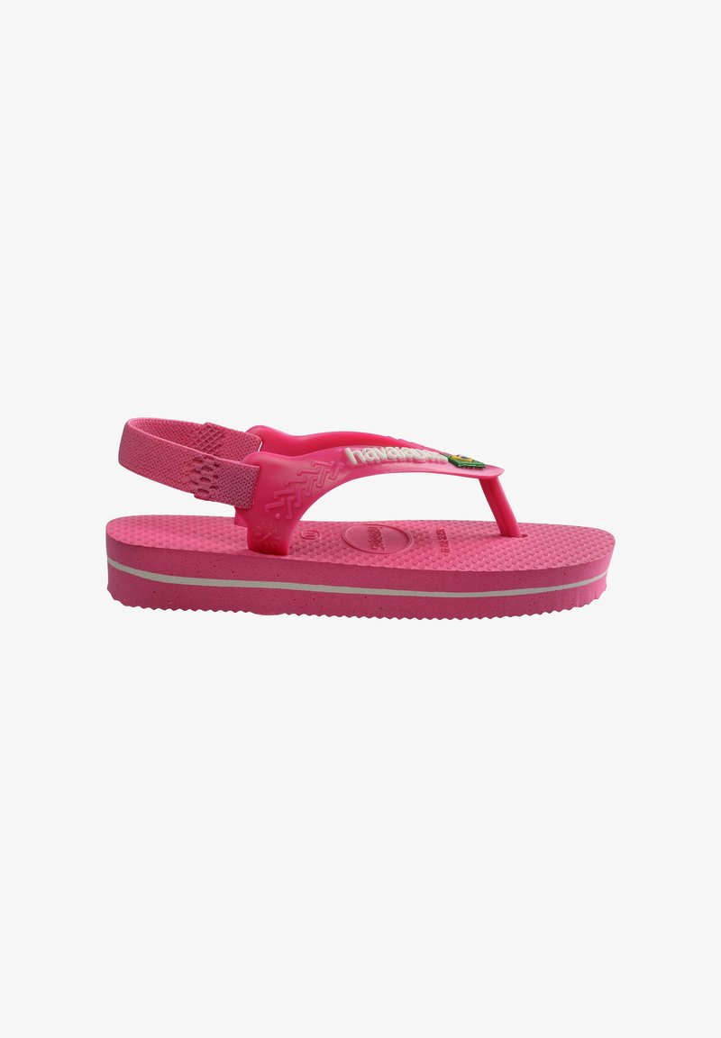 Chanclas de niña en color rosa con tiras traseras, plantilla texturizada, logo de la marca en blanco y un pequeño emblema decorativo en la tira.