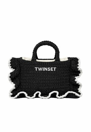 Borsa nera all'uncinetto con bordatura arricciata bianca, due manici corti e scritta "TWINSET" ricamata in bianco sulla parte anteriore.