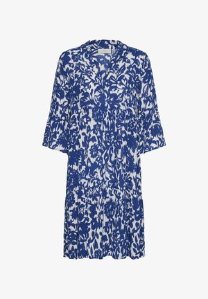 Robe bleu et blanche longueur genou avec manches longues et un motif floral audacieux, présentant un décolleté en V et une coupe ample.