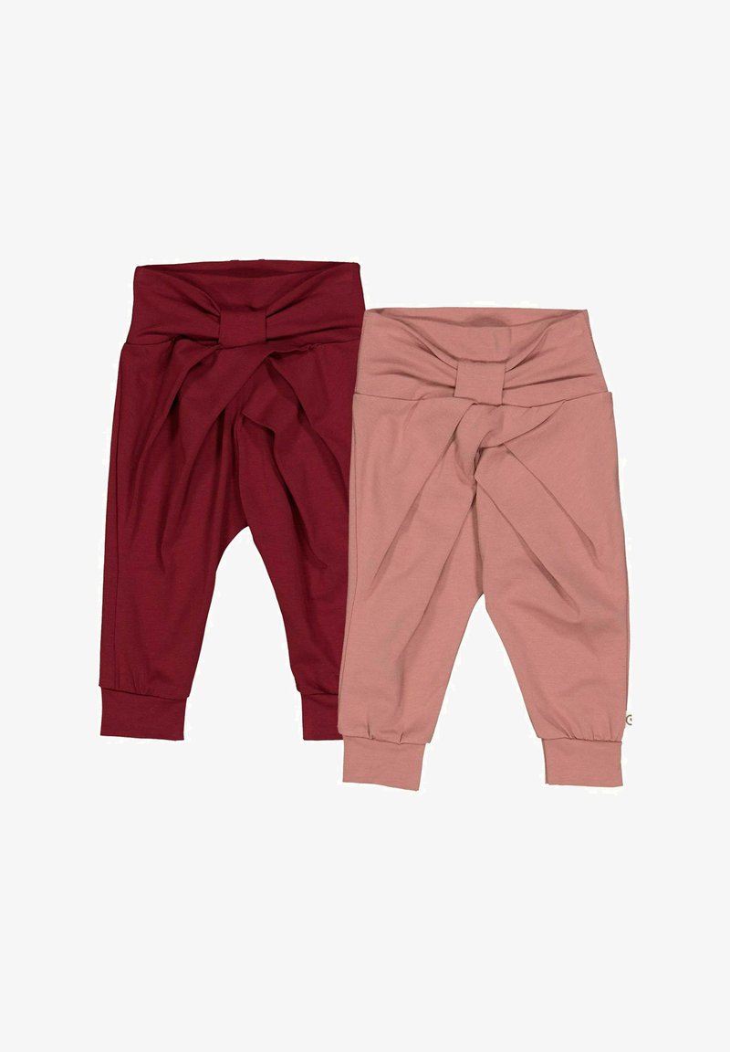 To sæt knyttede bukser, et i bourgogne og det andet i støvet rosa. De har et blødt, elastisk stof og tapered manchetter ved anklerne.