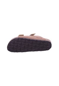 Tan slip-on sandal with a textured, dark brown rubber sole featuring a diamond pattern; strap accents and a cork footbed.