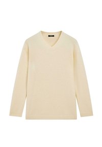 Pull en V crème avec des manches longues. Texture douce et poignets côtelés. Design simple sans motifs ni embellissements.