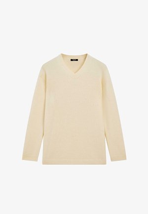 Creme v-hals sweater med lange ærmer. Blød tekstur og ribbede manchetter. Enkel design uden mønstre eller udsmykninger.
