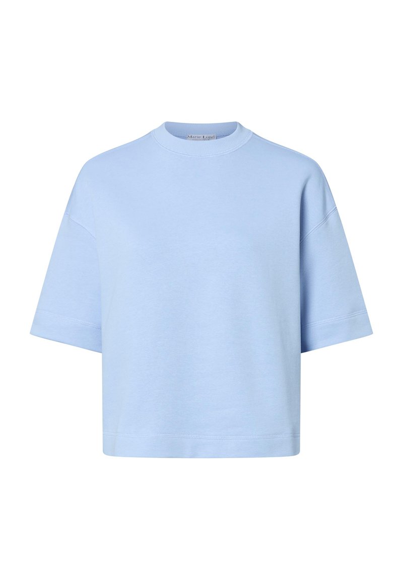 T-shirt in cotone azzurro chiaro a maniche corte con collo rotondo e vestibilità ampia. Presenta dettagli di cucitura minimali e nessun logo o motivo visibile.