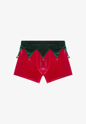 Red velvet boxers with a green velvety waistband featuring a scalloped design and gold jingle bells at the bottom.