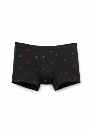 Schwarze Boxer-Shorts aus dehnbarem Stoff, mit einem Muster aus kleinen roten Schädeln, die gleichmäßig über das Material verteilt sind.