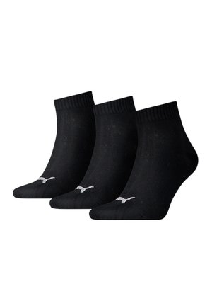 Calcetines de algodón negros hasta el tobillo, paquete de tres, con parte superior acanalada y acentos en blanco del logo a los lados. Textura suave con diseño ligero.