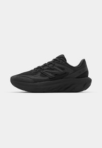 Black athletic shoe with a textured mesh upper, padded collar, and cushioned sole featuring a wave-like design. Laces and branding visible.