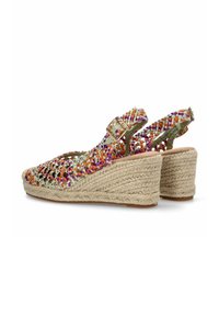 Sandalias de cuña con parte superior de tejido en hilos coloridos (naranja, morado) y suela de cuerda de yute. Correa ajustable con detalle de hebilla.
