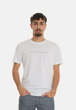 Witte katoenen t-shirt met korte mouwen en een ronde hals, met een subtiele logo-print in beige op de borst. Casual pasvorm.