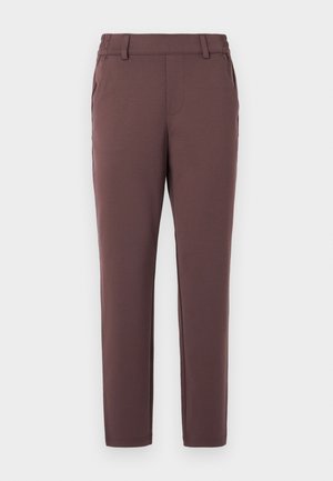 Brown, tapered trousers made of soft fabric. Features elastic waistband, belt loops, and two side pockets. Smooth texture with no visible patterns.