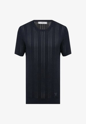 Maglietta in maglia blu navy a maniche corte con righe verticali bianche a punti e scollatura rotonda.