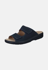 Mørkeblå sandal med to justerbare Velcro-stropper, åben tå og blød sål. Har syninger langs kanterne og en struktureret sål.