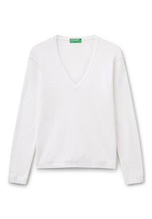 Witte langslavige V-hals trui van glad katoen. Heeft geribde details bij de halslijn en manchet. Rechte snit aan de onderkant.