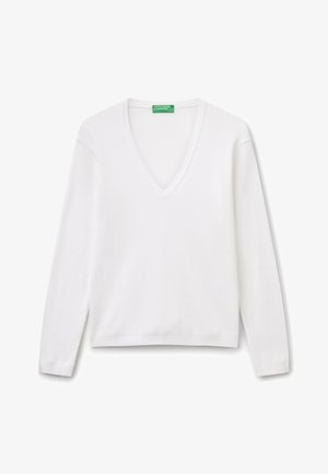 Witte langslavige V-hals trui van glad katoen. Heeft geribde details bij de halslijn en manchet. Rechte snit aan de onderkant.