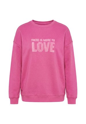 Lyserød langærmet sweatshirt med rund halsudskæring, der har lys rosa tekst "THERE IS MORE TO LOVE" på forsiden.