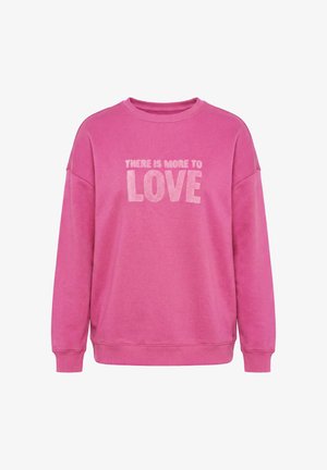Lyserød langærmet sweatshirt med rund halsudskæring, der har lys rosa tekst "THERE IS MORE TO LOVE" på forsiden.