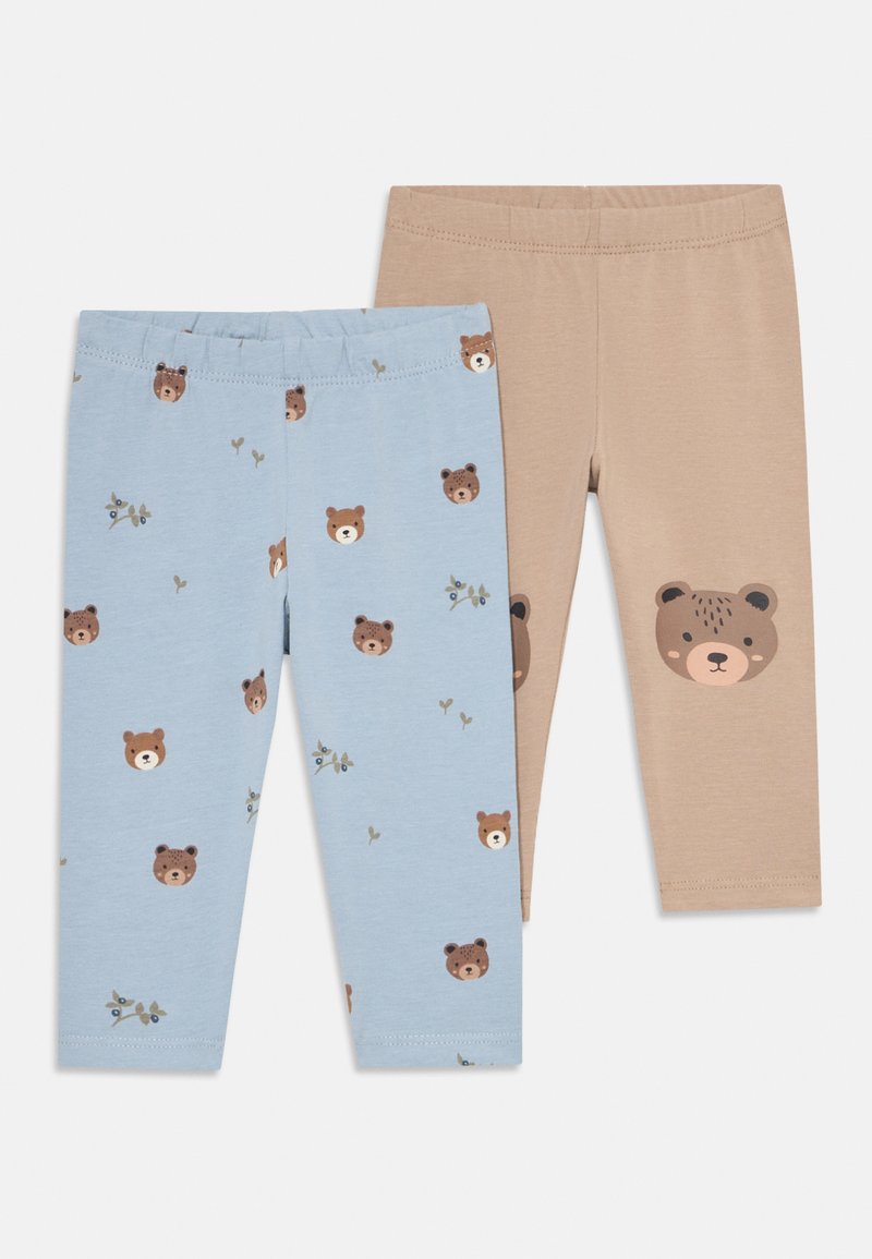 Two pairs of toddler leggings, one beige with a large bear face on knee, one light blue with small bear faces and sprigs pattern.