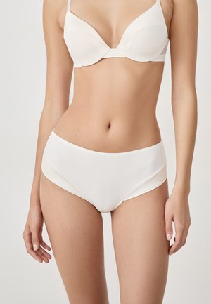 White lingerie set featuring a smooth, seamless bra with underwire and matching high-waisted briefs. Made from soft stretch fabric.