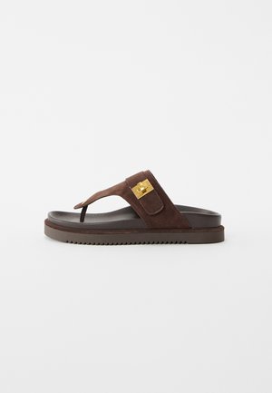 Brown suede thong sandal with thick sole and gold rectangular buckle on side strap, isolated on white background.