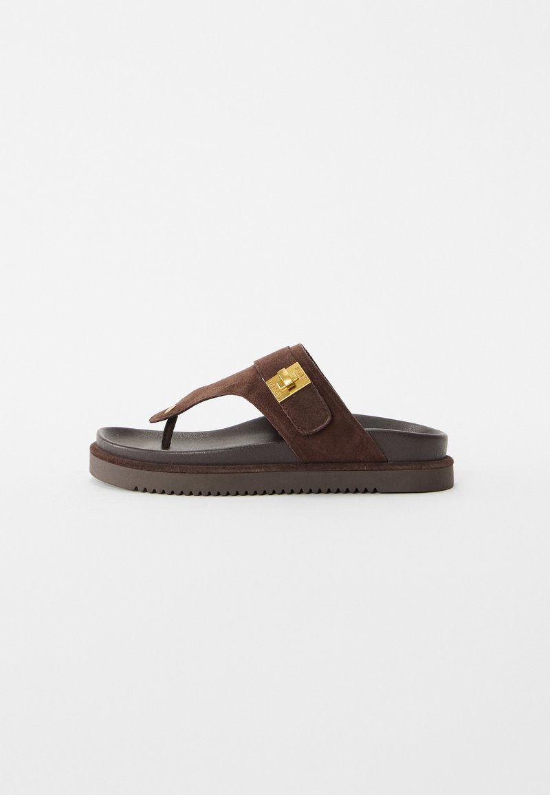 Brown suede thong sandal with thick sole and gold rectangular buckle on side strap, isolated on white background.