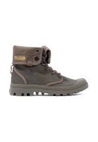 Braune Canvas-Stiefel bis zur Knöchel mit Gummikappe, runden Schnürsenkeln und PALLADIUM-Label am Schaft. Strukturiert an den Seiten und mit einer robusten Sohle mit Profil.