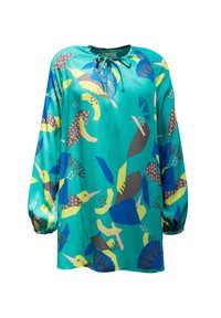Blouse en soie à coupe décontractée, avec un fond turquoise et des motifs colorés d'oiseaux et de feuilles. Manches longues avec poignets élastiques.