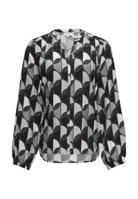 Blouse noir et blanc présentant un motif géométrique de formes audacieuses, des manches longues avec des poignets élastiques et un col rond. Tissu léger.