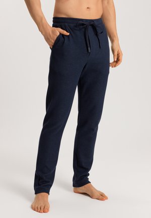 Navy blue joggers made of soft fabric, featuring a drawstring waist, side pockets, and a tapered leg design. Smooth texture and casual fit.