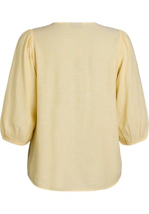 Vaaleankeltainen pusero, jossa on kolme neljänneksen mittaiset pussihihat ja joustavat kalvosimet, kuvattuna takaa valkoisella taustalla.