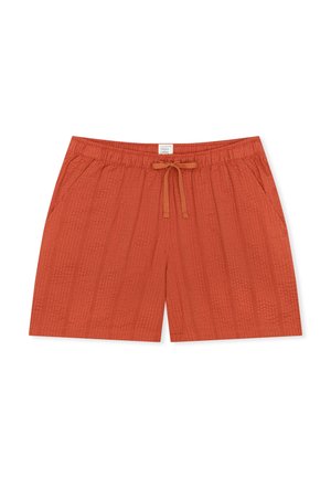 Pomarańczowe szorty z elastycznym pasem i sznurkiem, wykonane z teksturowanego materiału, posiadające boczne kieszenie i luźny krój.