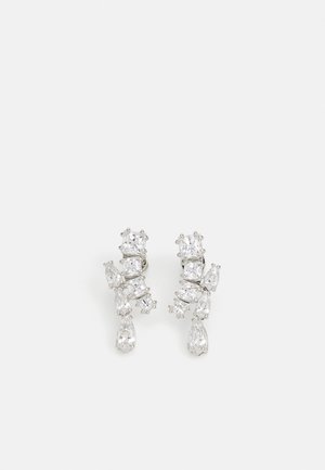 Silver-toned earrings featuring multiple clear, sparkling gemstones in various shapes, including pear and round cuts, arranged in a decorative pattern.