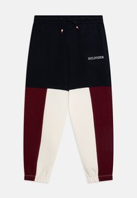 Bomulls-joggers med färgblockdesign i marinblått, vinrött och krämvitt, med elastisk midja och dragsko, samt "HILFIGER"-logotyp.