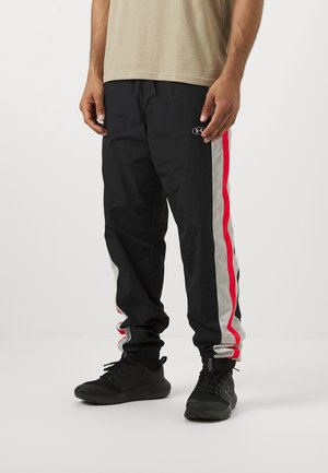 Under Armour ICON TRACK - Spodnji deli trenirk - black/white