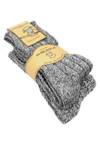 Graue gestrickte Socken mit einem strukturierten Muster. Verpackt mit einem Etikett, das eine Schafsgrafik und Angaben zum ABS-Griff zeigt.