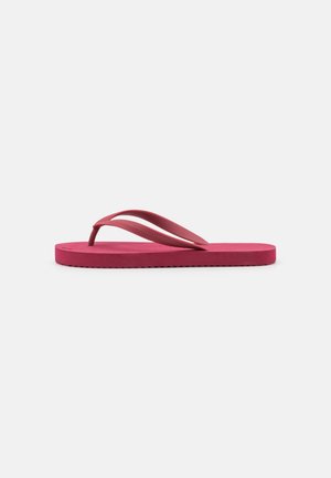 Pink rubber flip-flop with contoured footbed, flexible straps, and a textured sole. Features a flat design suitable for casual wear.