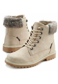 Botas de tobillo de ante beige con un cuello de pelo sintético, diseño de cordones, ojales metálicos y suela de goma con un patrón de tracción resistente.