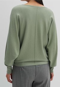 someday. Stickad tröja - green