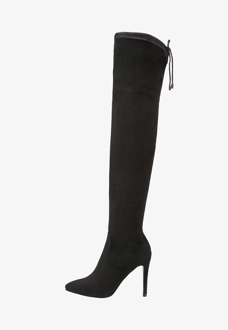 Botte noire cuissarde à talon stiletto avec bout pointu et lien à nouer en haut, en daim lisse avec talon fin.