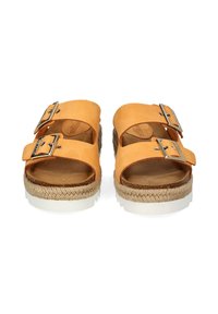 Tan leather slide sandals with two buckled straps, jute-wrapped midsole, and white rubber outsole. Flat footbed for comfort.
