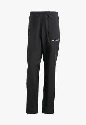 Melnas vieglās pārgājienu bikses ar elastīgu jostasvietu, sānu rāvējslēdzēja kabatu un atstarotāja TERREX logo detaļu. Gluda, ūdensnecaurlaidīga materiāla.