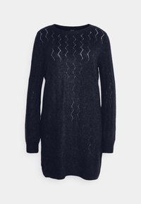 Robe pull en maille bleu marine, avec un col rond, des manches longues et un design ajouré à motifs sur le buste. Texture douce.
