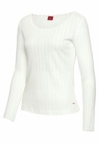 Top bianco a maniche lunghe con texture a coste, scollatura a onde e delicati inserti in pizzo sui polsini. Piccola etichetta con logo sul lato inferiore.